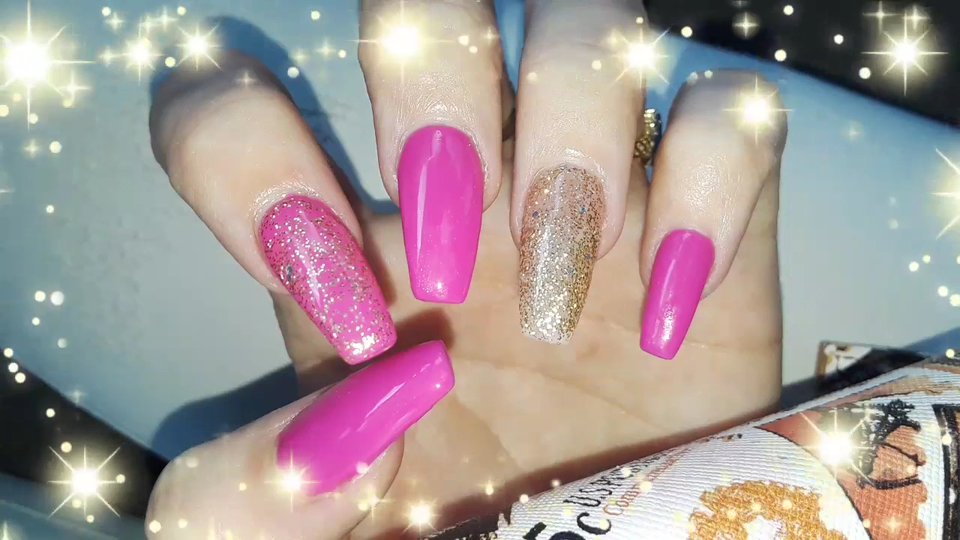 Close-up of polished nails and acrylic work.